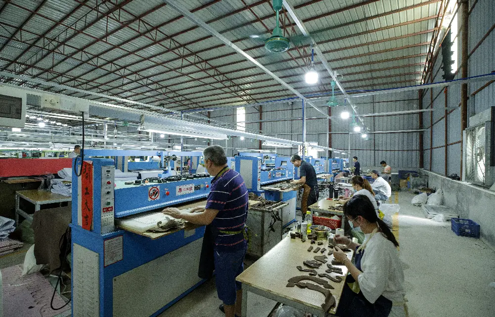 Cutting of shoe components at a partner factory